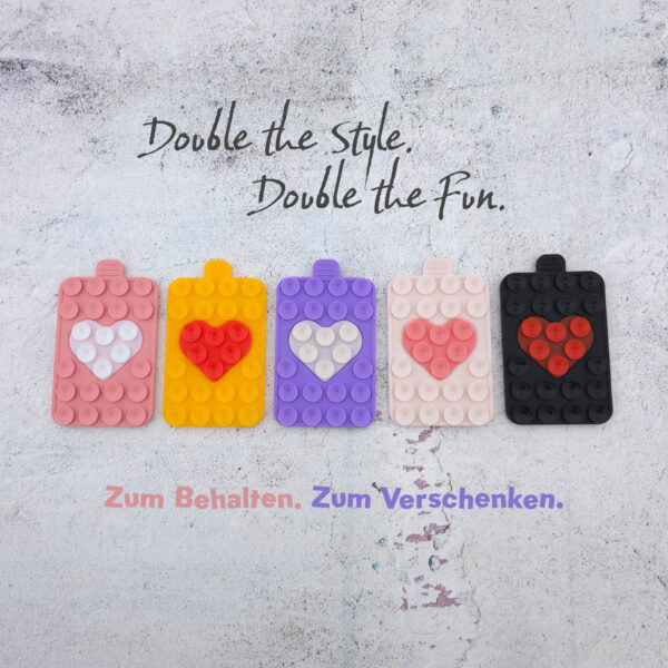 Fünf Noppie-Heart-Patch Farben als Saugnapf Handyhalterung im Überblick, Silikonhalterungen für Smartphone-Hüllen mit modernem Design