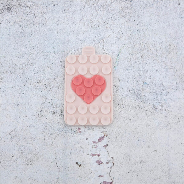 Suction cup phone holder in Soft Nude mit Peach-Herz, Silikonhalterung mit Saugnäpfen für glatte Oberflächen